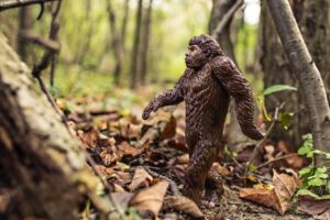 plastic bigfoot posed in the woods - supernatural chronicles